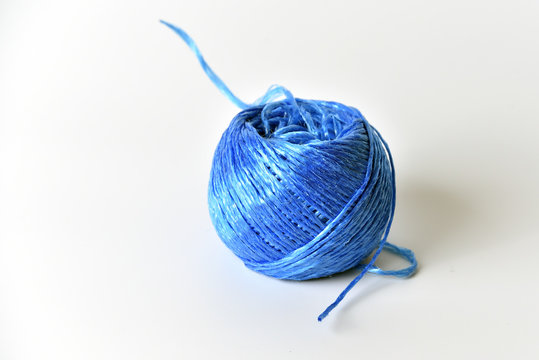 Tangle of blue rope on white background. Close up