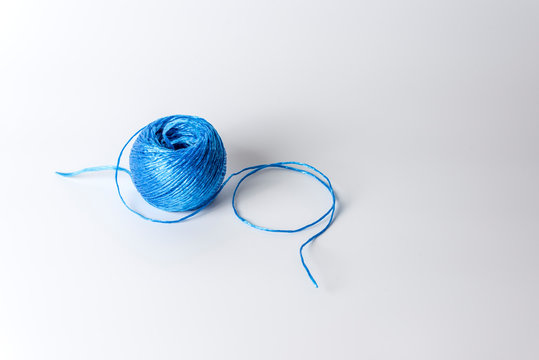 Tangle of blue rope on white background. Close up