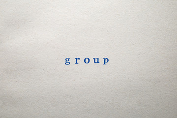 a GROUP word stamped on a piece of paper.