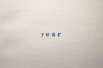a YEAR word stamped on a piece of paper.