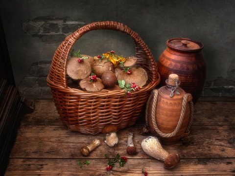 Still life with a basket of mushrooms on the floor