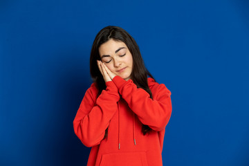 Brunette young girl wearing red jersey