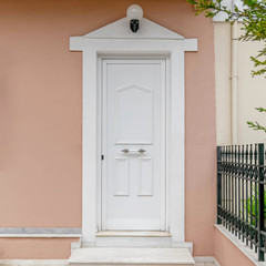 house entrance white door and dark pink wall