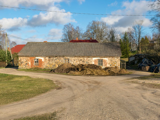 landscape with a stone barn