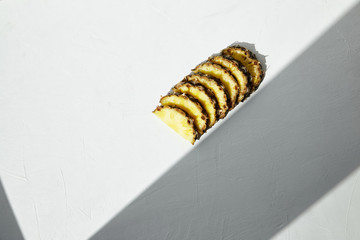 
Slices of juicy ripe pineapple and shadow geometry.
