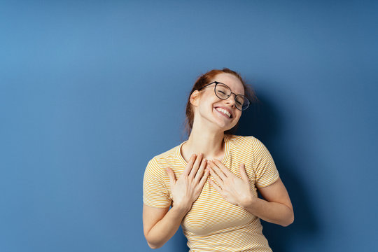 Cute young woman simpering at the camera
