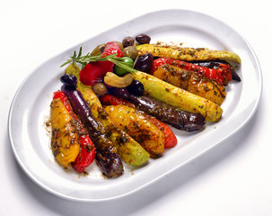 grilled vegetables on white plate with olives