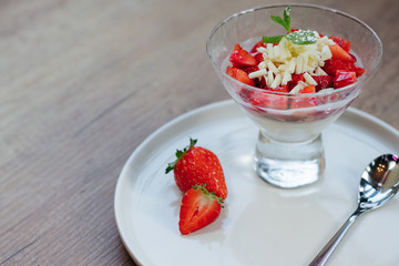 white chocolate strawberry cheesecake on a white plate