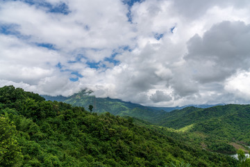 beautiful blue sky high peak mountains mist fog wildlife green forest at Khao Koh, Phu Tub Berk, Phetchabun, Thailand 
guiding idea long weekend for backpacker camping campfire relaxing hiking