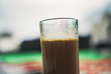Glass of Tea in Indian Style with Blur Background