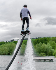 Flyboard on lake Liptovska Mara, Slovakia. Summer adrenaline attraction