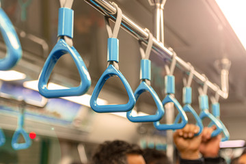 Fototapeta Close-up Subway or Metro Handrail, Hand holding blue Handrail	 obraz