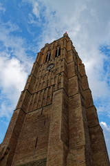 Fototapeta na wymiar The Bell Tower of the Catholic church of Saint Zephyrin in the suburbs of Dunkirk.