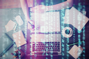 Multi exposure of writing hands on background with data solution hologram. Technology concept.