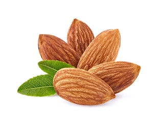 Almonds with leaves in closeup isolated on white background.