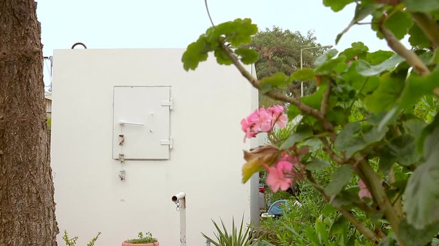 Mobile bomb shelter inside a home garden in Israel. This is an extra Fortified Room that helps the house residents to be protected from rocket fire attacks. It called Migunit" or "Merkhav Mugan"."