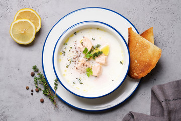 Creamy fish soup served with thyme. Traditional Finnish Kalakeitto Salmon Soup