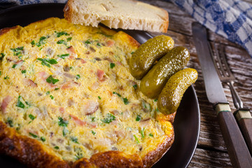Omelette with ham and parsley.