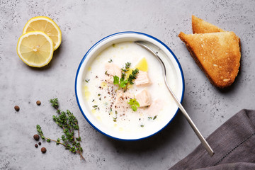 Creamy fish soup served with thyme. Traditional Finnish Kalakeitto Salmon Soup