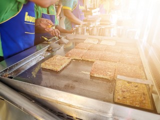 the chef hand is preparing murtabak for serving customers. murtabak is a well known food amongst malaysians