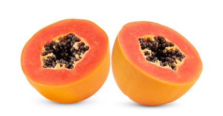 half  ripe papaya fruit with seeds  on white background