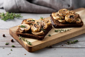 Toast with baked mushrooms champignons and bread