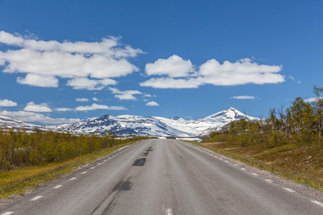 road passing in a valley between mountains in Sweden, selective focus