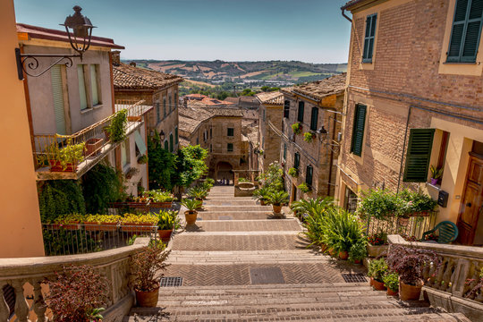 The Polenta Well steps of Corinaldo, Le Marche, Italy overlooking the beautiful Italian countryside on a warm Summer morning