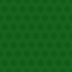 Seamless vector pattern with dark green clover leaves, shamrock on a green backdrop for St. Patrick's Day. Spring fest background for greetings card, flyer, decor, print, packaging design and more.