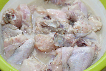 Marinating chicken with seasoning and herbs, preparation of cooking raw meat for fried