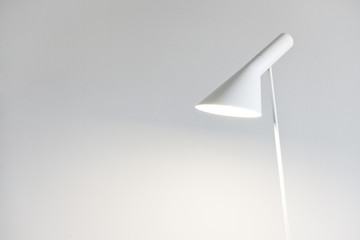Modern floor lamp against white background. Home interior concept. The Scandinavian interior design...