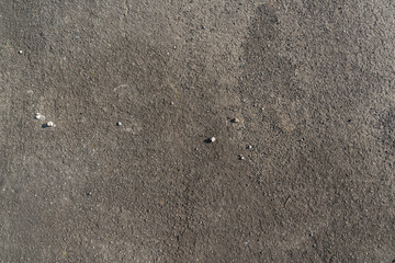 Texture of dark grey asphalt with small stones