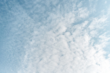 Texture of clouds and blue sky flowing between eachother