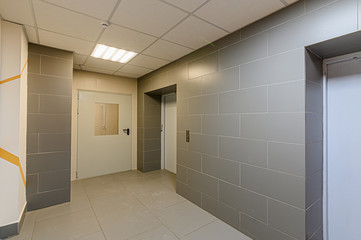 Russia, Moscow- December 05, 2019: interior room apartment public place, house entrance. doors, walls, corridors staircase
