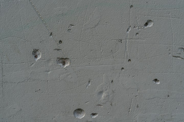 Texture of grunge and concrete wall with small holes