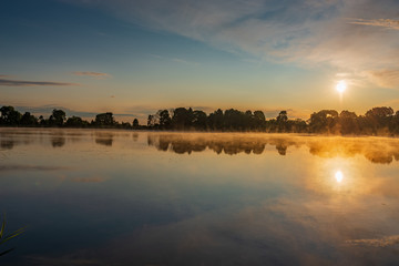 Morning low fog over the lake of the Joseph-Volotsky Monastery. Beautiful lake near the Joseph-Volotsky Monastery. The cloister is located in the village of Teryaevo.