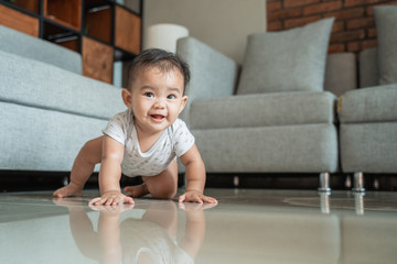 baby learn to crawl on the floor at home