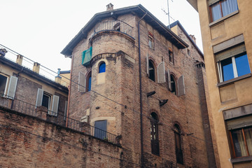 Fototapeta na wymiar Old tenement house located in historic part of Bologna city, Italy