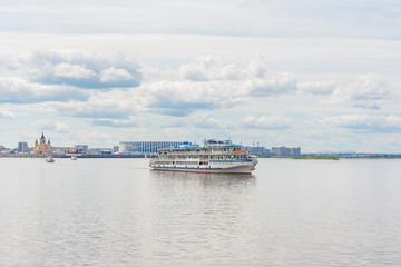 Three-deck motor ship goes along the city of Nizhny Novgorod