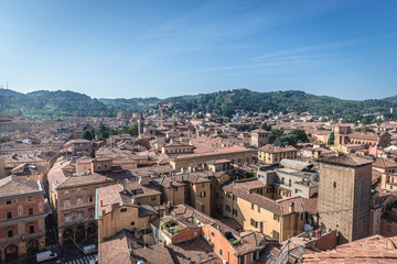 Fototapeta na wymiar Historic part of Bologna city, Italy - view from terrace of St Petronius Basilica with Galluzzi Tower on right side