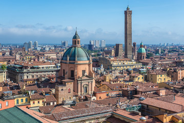 Panorama of historic part of Bologna city, Italy - view from St Petronius Basilica with dome of Santa Maria della Vita church and Two Towers