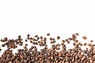 Shiny freshly roasted coffee beans on a white background. Isolated