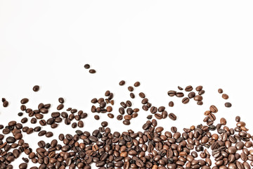 Shiny freshly roasted coffee beans on a white background. Isolated