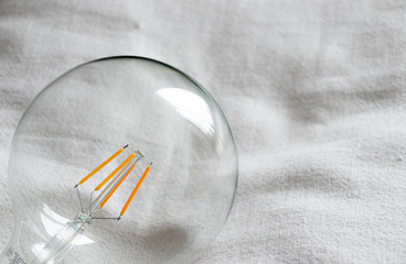 Big lightbulb on white cloth