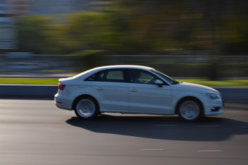 Obraz na płótnie Canvas fast moving car, panning photography