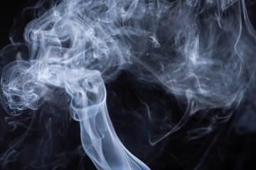 white flowing smoke cloud on black background