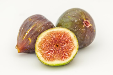 Fresh figs on a white background.