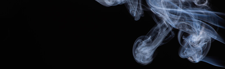 white flowing smoke cloud on black background with copy space, panoramic shot