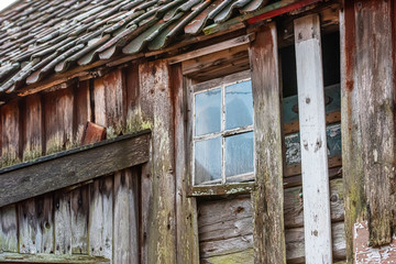 Small window on an old abandoned house.