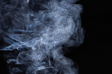 white flowing smoke cloud on black background